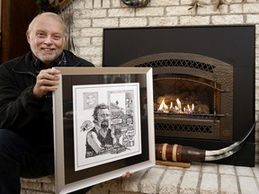 Mike Reid, son of CJAD legend Paul Reid, holds his Aislin cartoon of his father, created for Reid's induction into the CJAD Hall of Fame.