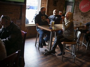 Bikers and enthusiasts drink at a local bar, on November 13, 2020 in Port Dover, Canada.