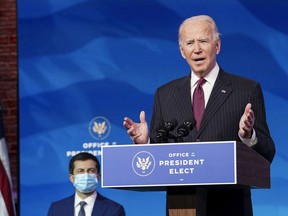 U.S. President-elect Joe Biden announces some of his administration's cabinet choices Wednesday, including nominating former Democratic presidential candidate Pete Buttigieg (left) to be Transportation Secretary.