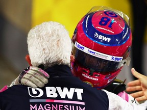 Third placed Lance Stroll of Canada and Racing Point celebrates with his father, Owner of Racing Point Lawrence Stroll in parc ferme during the F1 Grand Prix of Sakhir at Bahrain International Circuit on December 06, 2020 in Bahrain, Bahrain.