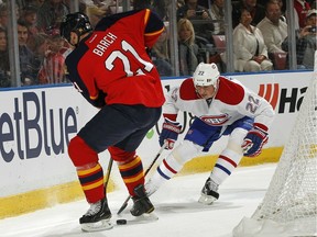 Montreal Canadiens' Tomas Kaberle battles Krystofer Barch of the Florida Panthers on Dec. 31, 2011, in Sunrise, Fla.
