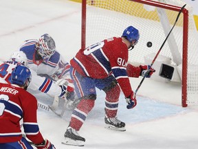 Montreal Canadiens' Tomas Tatar scores on New York Rangers' Alexandar Georgiev during second period in Montreal on Feb. 27, 2020.