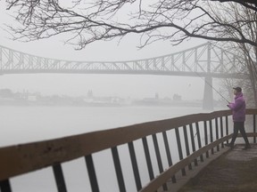 A fisherman tries his luck in the drizzle and fog of Christmas Day in Montreal on Friday, December 25, 2020. (Allen McInnis / MONTREAL GAZETTE) ORG XMIT: 65533