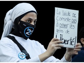 A Muslim woman takes part in a protest against Bill 21 in Montreal on Nov. 8.