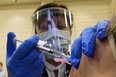 A patient receives the Pfizer/BoiNTech vaccine at Toronto University Health Network Safety Services