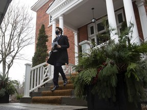 Prime Minister Justin Trudeau walks to the podium for a news conference outside Rideau cottage in Ottawa on Friday, Dec. 4, 2020.
