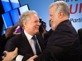 Jean Charest, left, and Philippe Couillard are among the six former Quebec premiers who signed an open letter stating that the protection of the French language “demands that elected officials be vigilant at all times.”