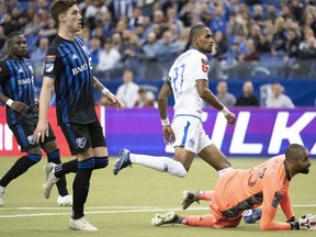 Montreal Impact goalkeeper Clement Diop watches the ball go into the net on a goal by CD Olimpia forward Jerry Bengtson during first half of the first leg of the 2020 CONCACAF Champions League quarterfinals in Montreal on Tuesday, March 10, 2020.