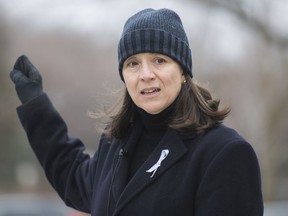 Nathalie Provost, a survivor of the École Polytechnique shooting in 1989, speaks during commemorative event in Montreal on Sunday, Dec. 6, 2020, on the 31st anniversary of the murder of 14 women in an anti-feminist attack at the university on Dec. 6, 1989.