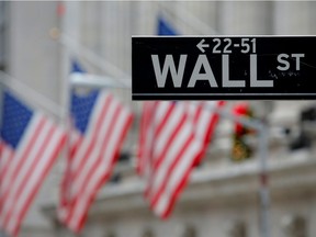 A street sign for Wall St. is seen outside the New York Stock Exchange (NYSE) in Manhattan in this file photo.