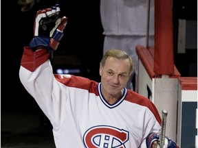 Hall of Famer Guy Lafleur waves to the crowd as he steps on to the ice during celebrations to mark the 100th anniversary of the Montreal Canadiens in Montreal on Dec. 4, 2009.