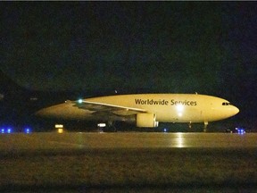 A cargo plane taxis on the tarmac at Mirabel Airport in Mirabel on Sunday, with some of the first COVID-19 vaccines being delivered to Canada.