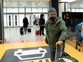 Passengers arrive at Fiumicino airport after the Italian government announced all flights to and from the UK will be suspended over fears of a new strain of the coronavirus, amid the spread of the coronavirus disease (COVID-19), in Rome, Italy, December 20, 2020. REUTERS/Remo Casilli