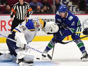 St. Louis Blues goaltender Jake Allen stops Vancouver Canucks forward Loui Eriksson at Rogers Arena in Vancouver on Jan. 27, 2020.