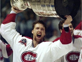 Patrick Roy holds the Stanley Cup aloft after the Canadiens defeated the L.A. Kings to win the Stanley Cup on June 9, 1993.