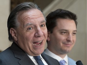 Premier Francois Legault (left) and the minister responsible for language, Simon Jolin-Barrette, have promised to introduce additional measures to protect French early in the new year.
