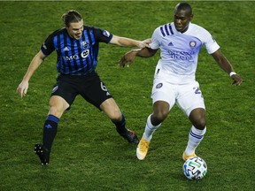Orlando City defender Kamal Miller, right, and Montreal Impact midfielder Samuel Piette battle for the ball during match on Nov. 1, 2020, at Red Bull Arena in Harrison, NJ.