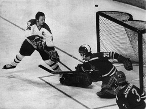 Central Red Army goalie Vladislav Tretiak foils Montreal Canadiens captain Yvan Cournoyer, one of 35 saves he made during the famous game at the Montreal Forum on Dec. 31, 1975.