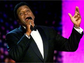 FILE PHOTO: Country music legend Charley Pride performs a medley of his music at the 34th annual Country Music Association Awards show at the Grand Ole Opry House in Nashville, Tennessee October 4, 2000./File Photo