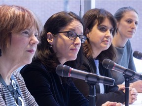 Hélène David of the Liberals, then-Quebec Justice Minister Sonia LeBel, Véronique Hivon of the PQ and Christine Labrie of Québec solidaire, left to right, listen to a question after announcing the formation of a committee of experts to accompany victims of sexual assault and of domestic violence in Montreal on Monday, March 18, 2019. Since then, the trans-partisan group's membership has changed. Isabelle Charest of Coalition Avenir Québec has replaced LeBel and Isabelle Melançon has replaced David.