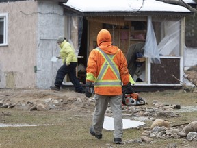Volunteers arrive to help residents Saturday, December 26, 2020  in Sainte-Brigitte-de-Laval Que. A flash flood forced the evacuation of residents on Christmas day, Dec. 25, as the waters of the Montmorency river came up because of heavy rains.