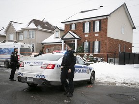 Laval police in front of a home on Monday, Jan. 4, 2021 where a seven-year-old girl died the previous day.