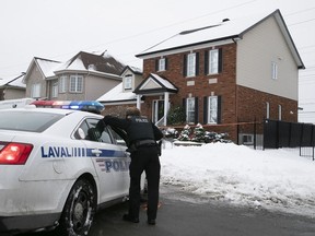 Laval police in front of the home on Le Boutillier in Chomedey on Monday, Jan. 4, 2021, where a 7 year-old girl died on Sunday.