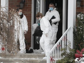 Laval major crime scene specialists leave a home where a 7 year-old girl died on Sunday