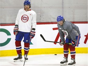 Newly-acquired forwards Josh Anderson, left, and Tyler Toffoli wait their turns during Montreal Canadiens training-camp practice at the Bell Sports Complex in Brossard on Jan. 4, 2021.