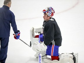 Newly-acquired netminder Jake Allen listens to goaltending coach Stépahne Waite during Montreal Canadiens training-camp practice at the Bell Sports Complex in Brossard on Jan. 4, 2021.
