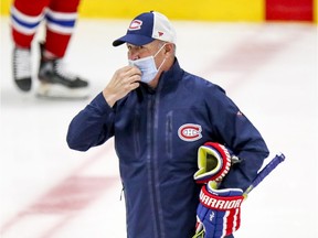 Canadiens head coach Claude Julien — and all the coaches — are wearing masks during training camp because of COVID-19.