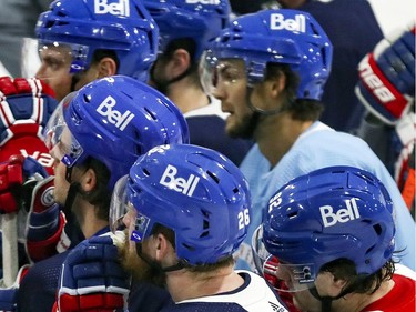 Montreal Canadiens players listen to coach Claude Julien training camp practice at the Bell Sports Complex in Brossard on Tuesday Jan. 5, 2021.  For the first time, the NHL has allowed teams to put advertising on players' helmets.