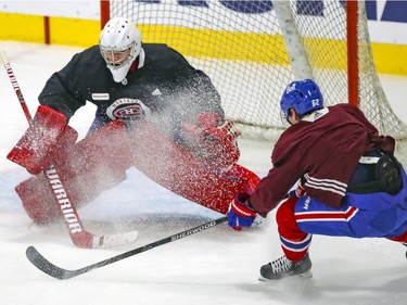 Carey Price gets a snow shower from teammate Artturi Lehkonen during Montreal Canadiens training camp practice at the Bell Sports Complex in Brossard on Tuesday Jan. 5, 2021.
