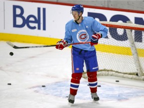 Corey Perry practices deflecting pucks in front of the net during his first day on the ice at Canadiens training camp Tuesday at the Bell Sports Complex in Brossard.