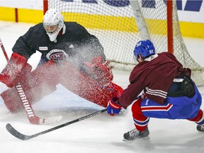 Carey Price gets a snow shower from teammate Artturi Lehkonen during Montreal Canadiens training camp practice at the Bell Sports Complex in Brossard on Tuesday, Jan. 5, 2021.