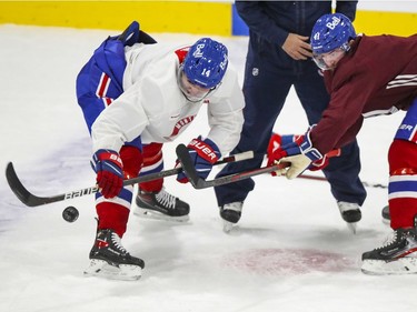 Nick Suzuki, left, and Paul Byron practice face-offs during Montreal Canadiens training camp practice at the Bell Sports Complex in Brossard on Tuesday Jan. 5, 2021.