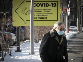 Man walks past COVID testing clinic at the Jewish General hospital on Jan. 6, 2021