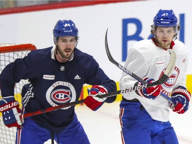 Josh Anderson, right, crosses sticks with defenceman Joel Edmundson during Montreal Canadiens training camp practice at the Bell Sports Complex in Brossard on Wednesday, January 6, 2021.