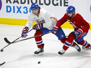 Josh Anderson, left, competes for loose puck with Tomas Tatar during Montreal Canadiens training camp practice at the Bell Sports Complex in Brossard on Wednesday, January 6, 2021.