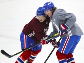 Tyler Toffoli, right, leans on Jake Evans during Canadiens training camp practice at the Bell Sports Complex in Brossard on Wednesday.