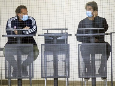 Montreal Canadiens general manager Marc Bergevin, right, watches training camp practice with John Sedgwick, vice president of hockey operations and legal affairs, at the Bell Sports Complex in Brossard on Wednesday, January 6, 2021.