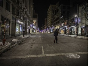 A homeless man crosses Saint Catherine St.  on Jan. 9, 2021 in Montreal.