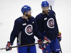 Jeff Petry, left, chats with Shea Weber during training camp on Monday.