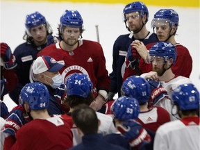 Canadiens head coach Claude Julien speaks with his players during training-camp practice at the Bell Sports Complex in Brossard.