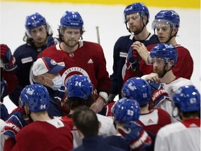 Montreal Canadiens head coach Claude Julien speaks with the team during training camp in Montreal on Jan. 11, 2021.