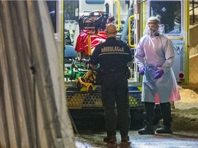 Paramedics take a patient from their ambulance at the emergency department of St. Mary's Hospital in Montreal on Tuesday, January 12, 2021.