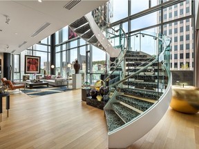 A circular glass and steel staircase brings residents to the second-storey of the $11-million condo.