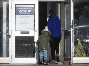 A family enters a COVID-19 screening clinic in Kirkland last month.