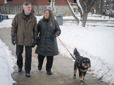 Suzie and Henry Rosenhek out walking Fenway, the family dog of one of their daughters.