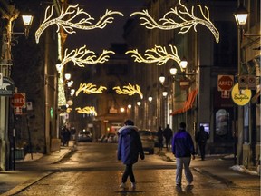 Armies of Montrealers, like these on St-Paul St. after dark on Thursday, have been outdoors walking this winter, because what else can you do?